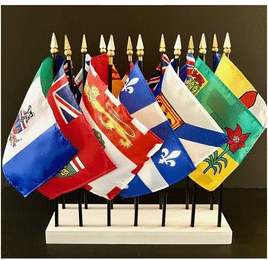 a photo of six miniature world flags set in a single round black stand