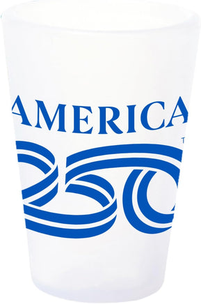 A white shot glass with the America 250 logo printed on it in blue.